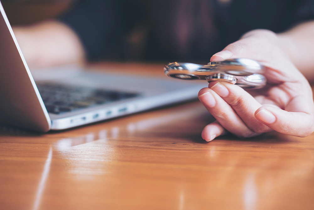 a-teen-on-the-computer-with-gadget-in-hand