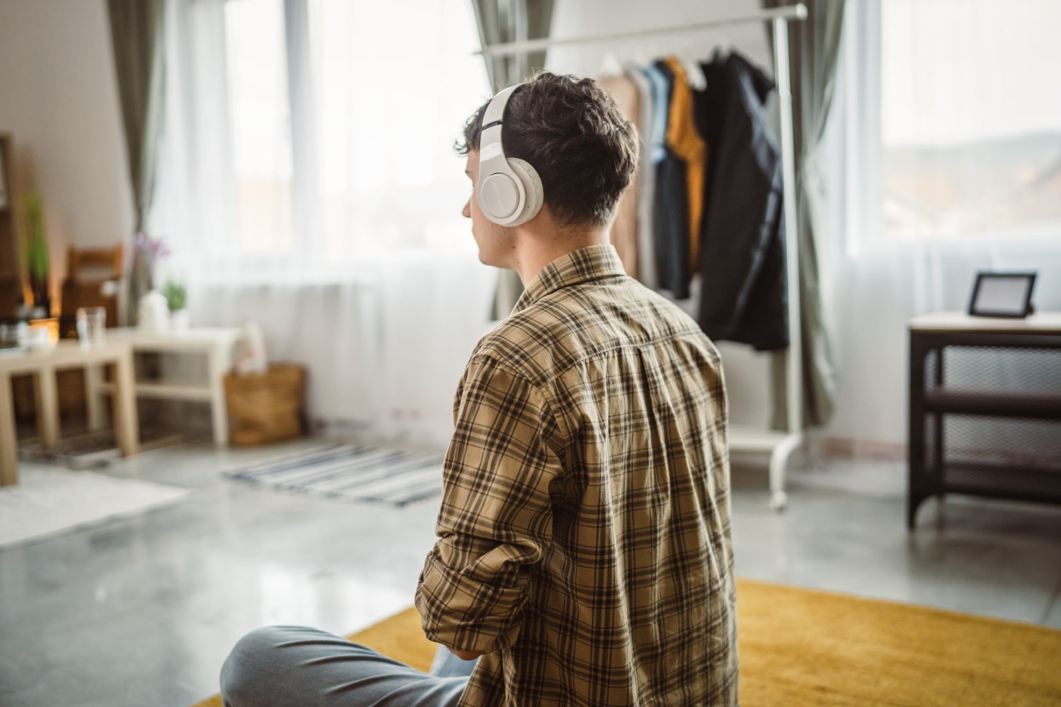 teen boy meditating as part of his daily self-care routine