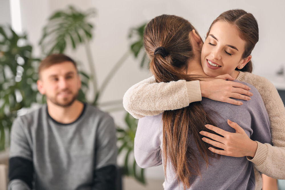 teen-girls-hugging-in-group-therapy