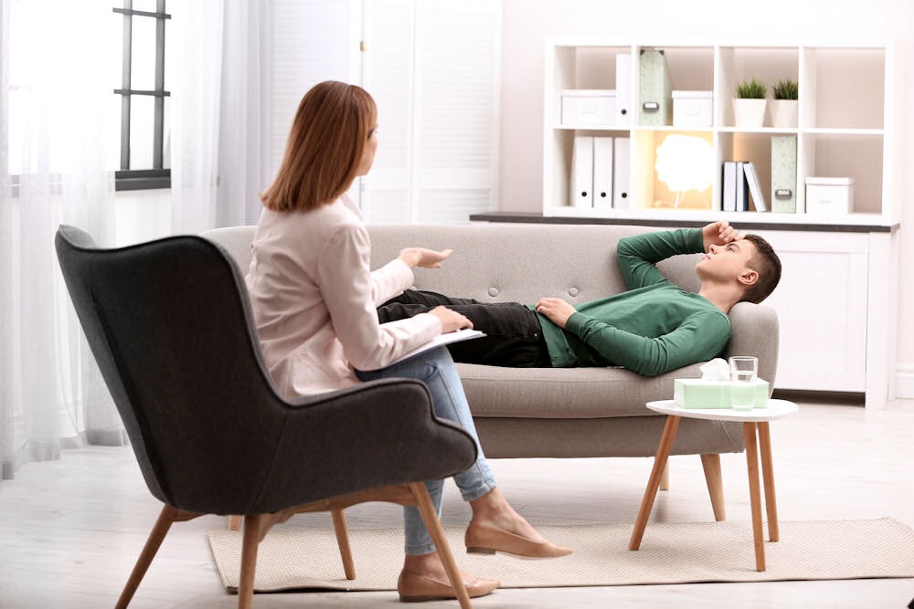 a teen boy laying down in therapy