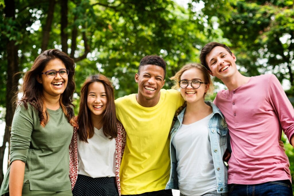 a group of teens smiling