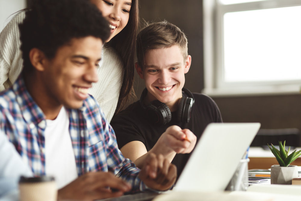 teen boys participating in an academic program and learning together