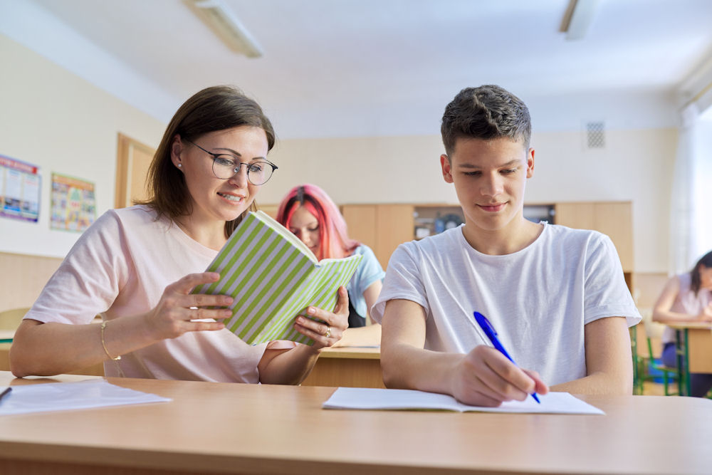 teen boy engaged in a structured learning environment for focused growth