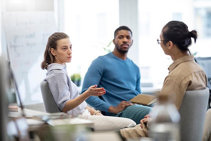 therapist guiding teens in adolescent dual diagnosis outpatient