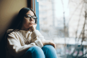 teen girl reflecting thoughtfully during a self-harm awareness session